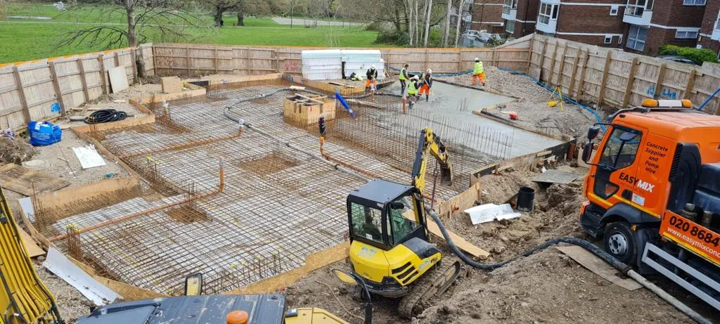A construction site with a bulldozer and excavator.