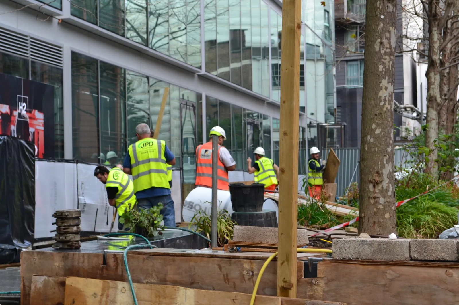 A group of construction workers standing next to each other.